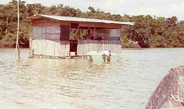 they rowed the canoe to their little house built out in the middle of the lake