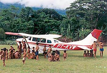 mission airplane on grass air strip (photo courtesy of Mission Aviation Fellowship - MAF)