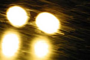 car lights in blinding rain